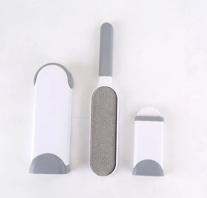 A reusable pet hair remover comb with a self-cleaning base, perfect for removing fur and lint from sofas, chairs, and other upholstery.