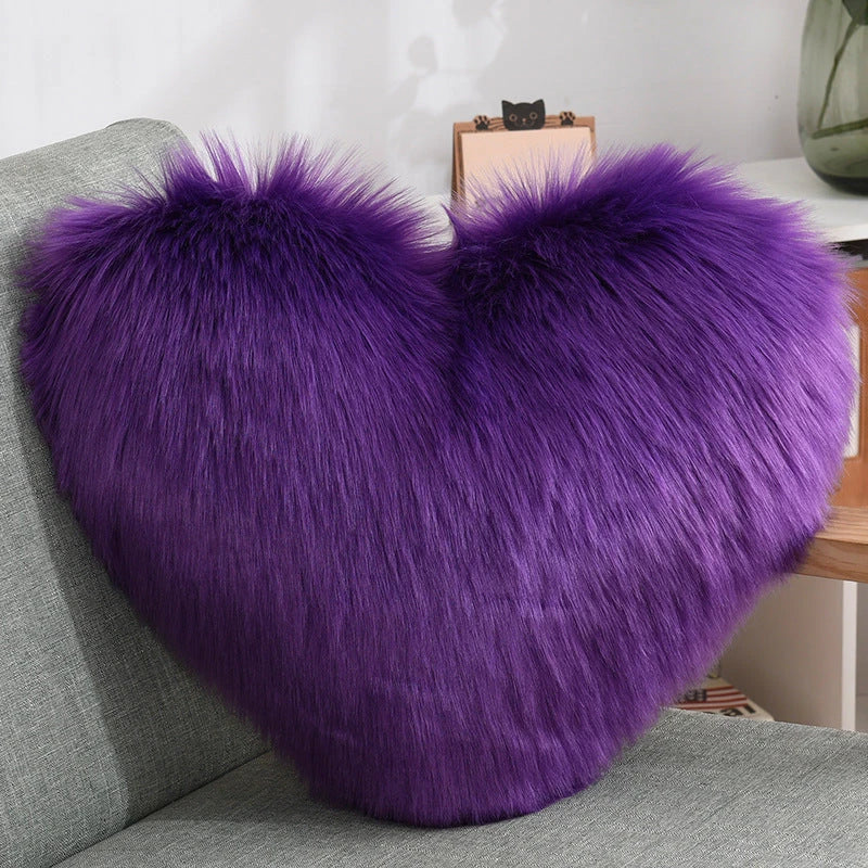 Cozy heart-shaped throw pillow with plush, shaggy texture in various colors