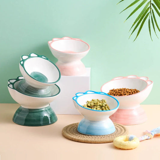 Ceramic pet bowl with 15-degree incline design in pink, green, and blue