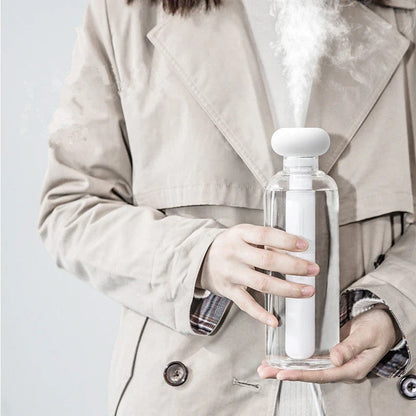 Compact and portable USB-powered air humidifier and essential oil diffuser with versatile water container design