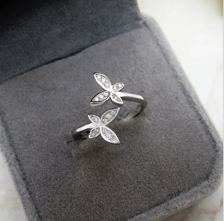 Sterling Silver Adjustable Butterfly Ring with gem accents on a white background