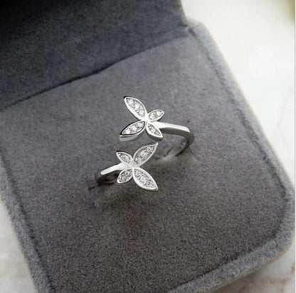 Sterling Silver Adjustable Butterfly Ring with gem accents on a white background