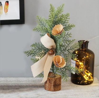 Artificial Christmas tree with red berries and flocked snow effect, 25cm in height