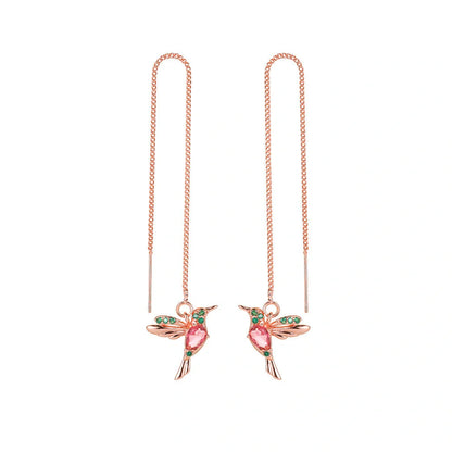 Elegant hummingbird drop earrings with crystal accents, a versatile fashion accessory for British women