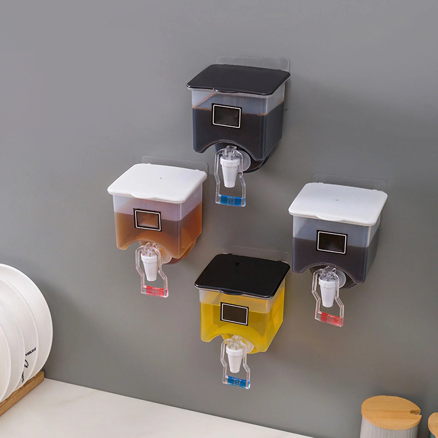 Wall-mounted condiment bottles in white and black, featuring press handle for easy pouring