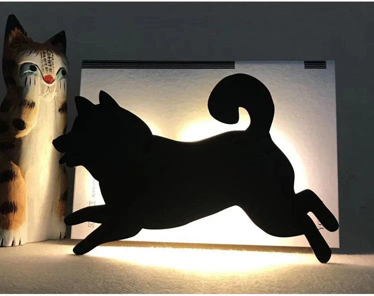 A stylish cat-shaped smart sensor night light that automatically illuminates a room when motion is detected, creating a warm and cozy atmosphere.