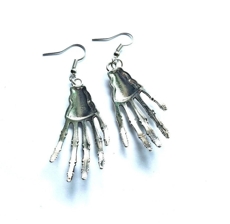 Elegant vintage carved skull and skeleton hands earrings in gold, bronze, and silver finishes