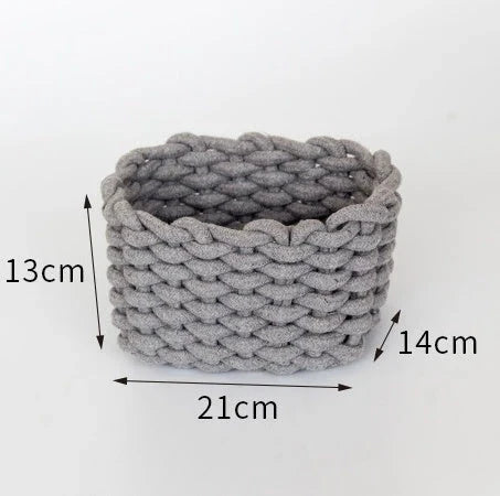 Hand-woven cotton rope storage basket in grey and white colours, featuring a minimalist nordic design for practical and stylish home organisation