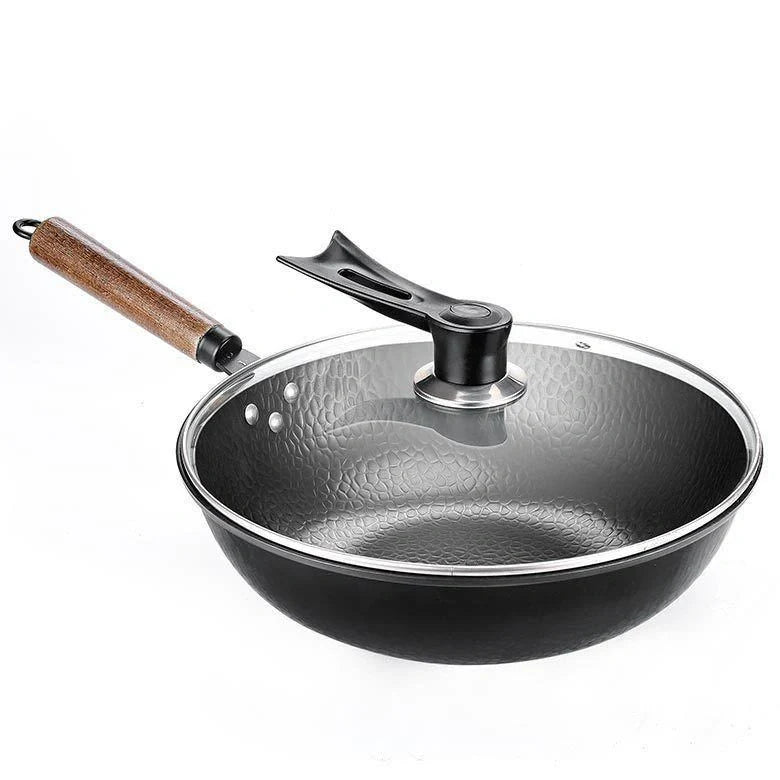 Traditional handmade iron wok with wooden handle and lid
