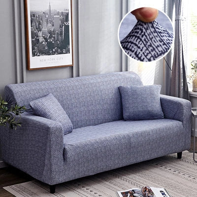 Stretchable geometric print sofa cover on a three-seater sofa