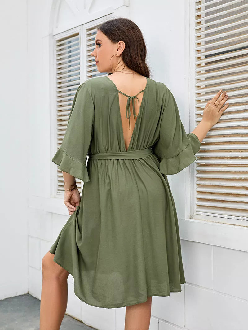 Plus-size green party skirt with V-neck and ruffle sleeves