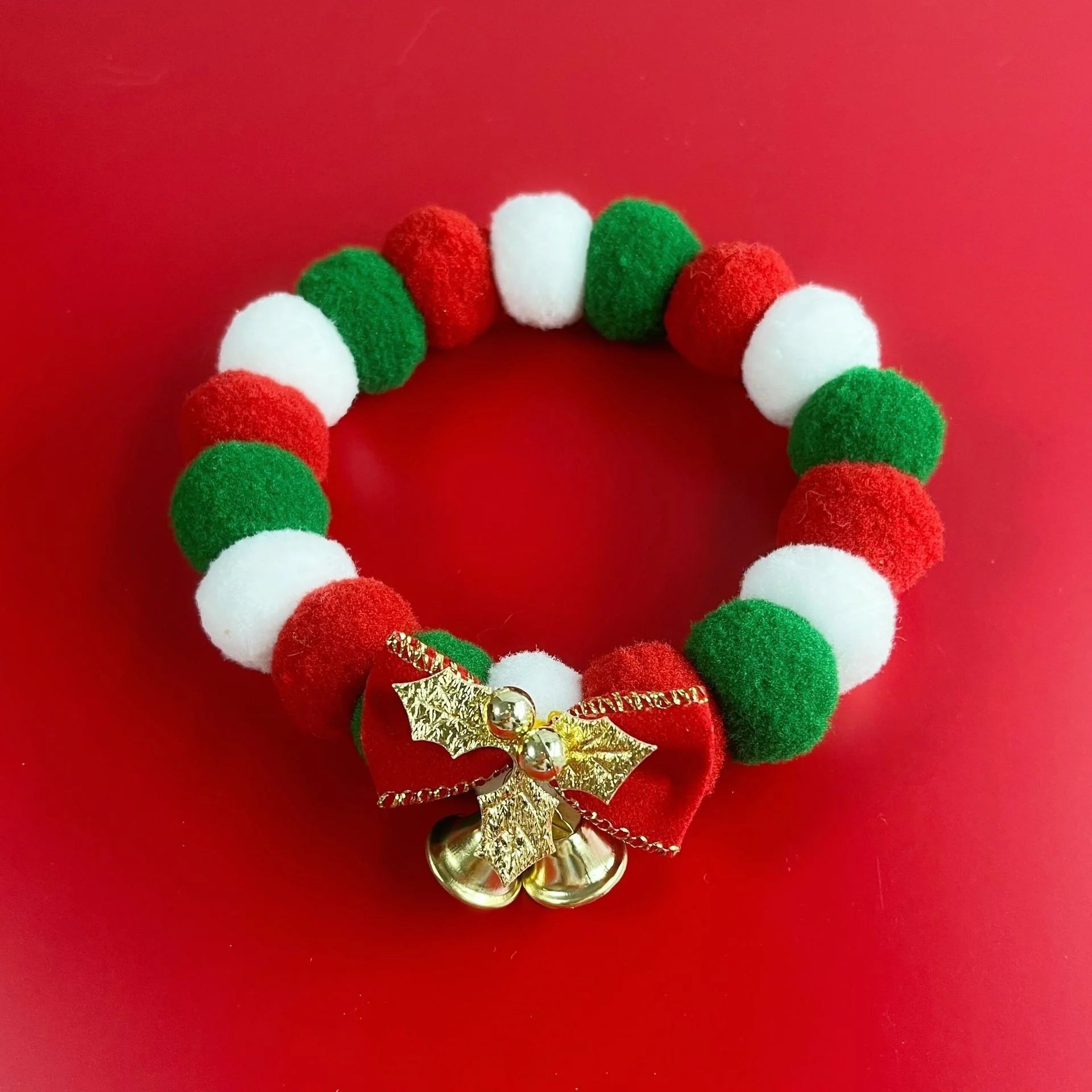 Festive plush ball pet collar with elastic fit for Christmas in green and golden leaves designs