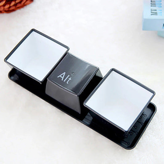 Three keyboard-inspired mugs in white and black colours, arranged on a wooden tray with a minimalist desk setting