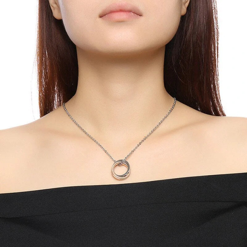 Stainless steel couple necklace with black men's and rose gold women's versions