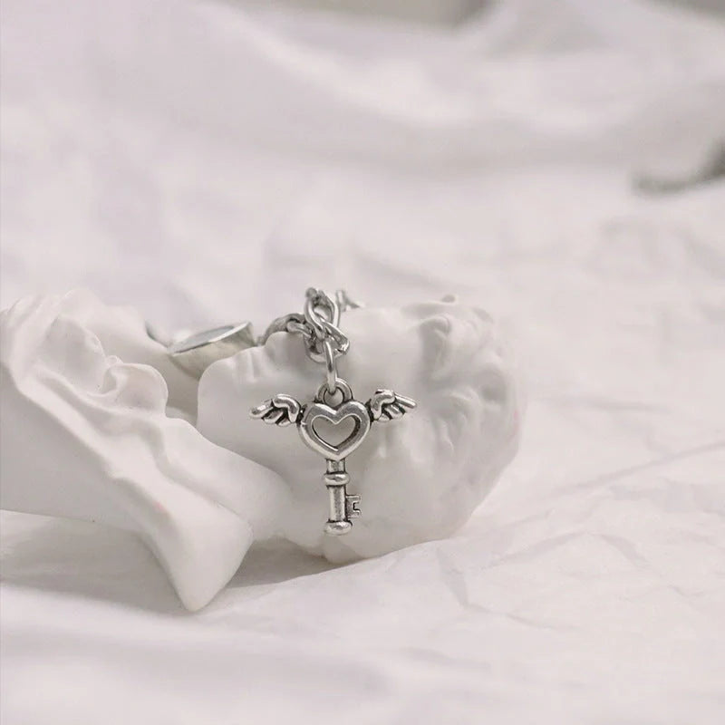 Floral heart-shaped couple bracelets with adjustable iron chains, symbolising love and friendship.