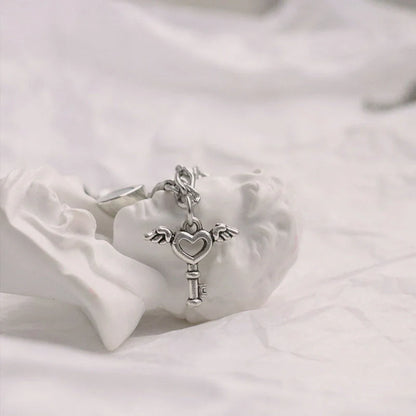 Floral heart-shaped couple bracelets with adjustable iron chains, symbolising love and friendship.