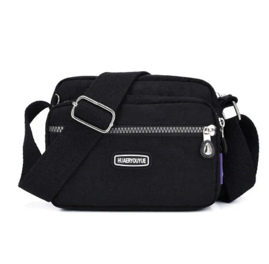Small square messenger bag in water-repellent nylon with multi-compartment design