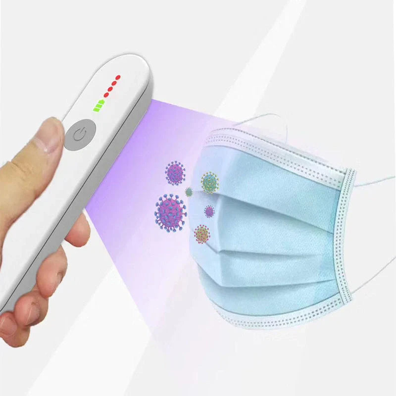 Portable UV disinfection lamp sterilizing a mobile phone