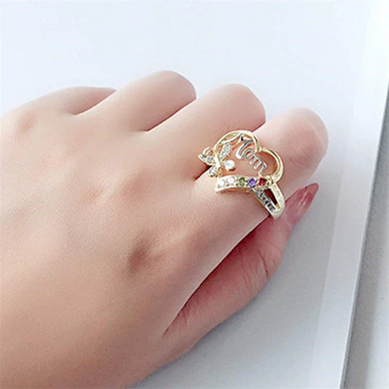 Elegant rhinestone heart-shaped ring in gold color with a dazzling array of multicolored rhinestones