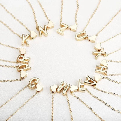 Heart-shaped pendant necklace with adjustable chain in various metallic finishes