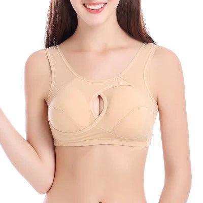 Supportive cotton sports bra with crossover design for lift and support, preventing sagging and bra lines