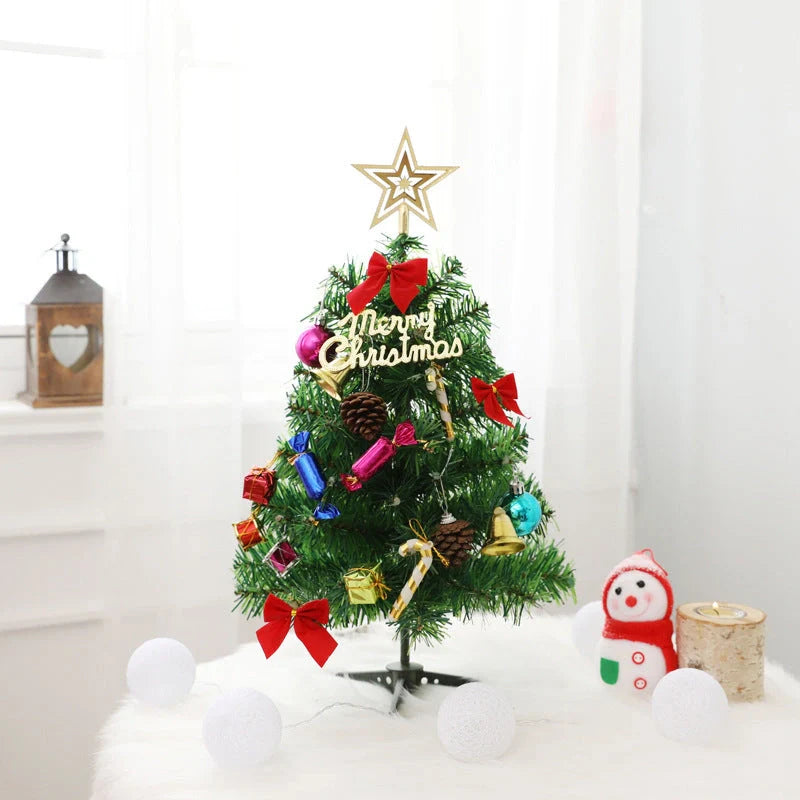 Mini Christmas tree with snowflake LED lights and decorative bows, bells, and pine cones