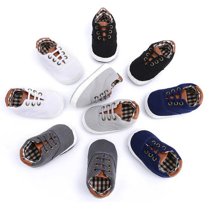 Solid colour baby canvas shoes with soft bottom and front strap in sizes 11cm to 13cm