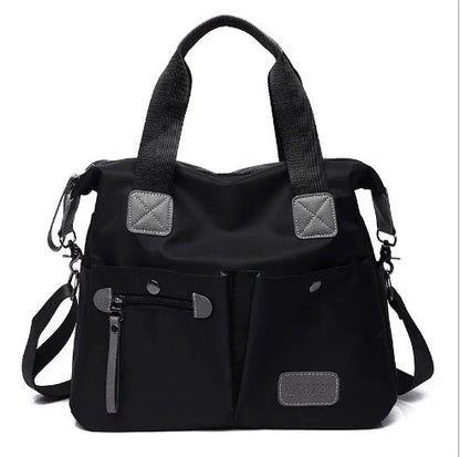 Versatile ladies shoulder bag with multiple carry options, numerous pockets, and durable Oxford fabric construction