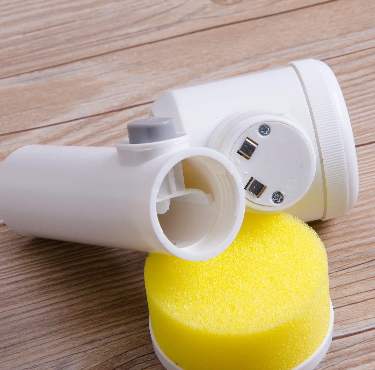 5-in-1 electric cleaning brush with white handle and three interchangeable heads