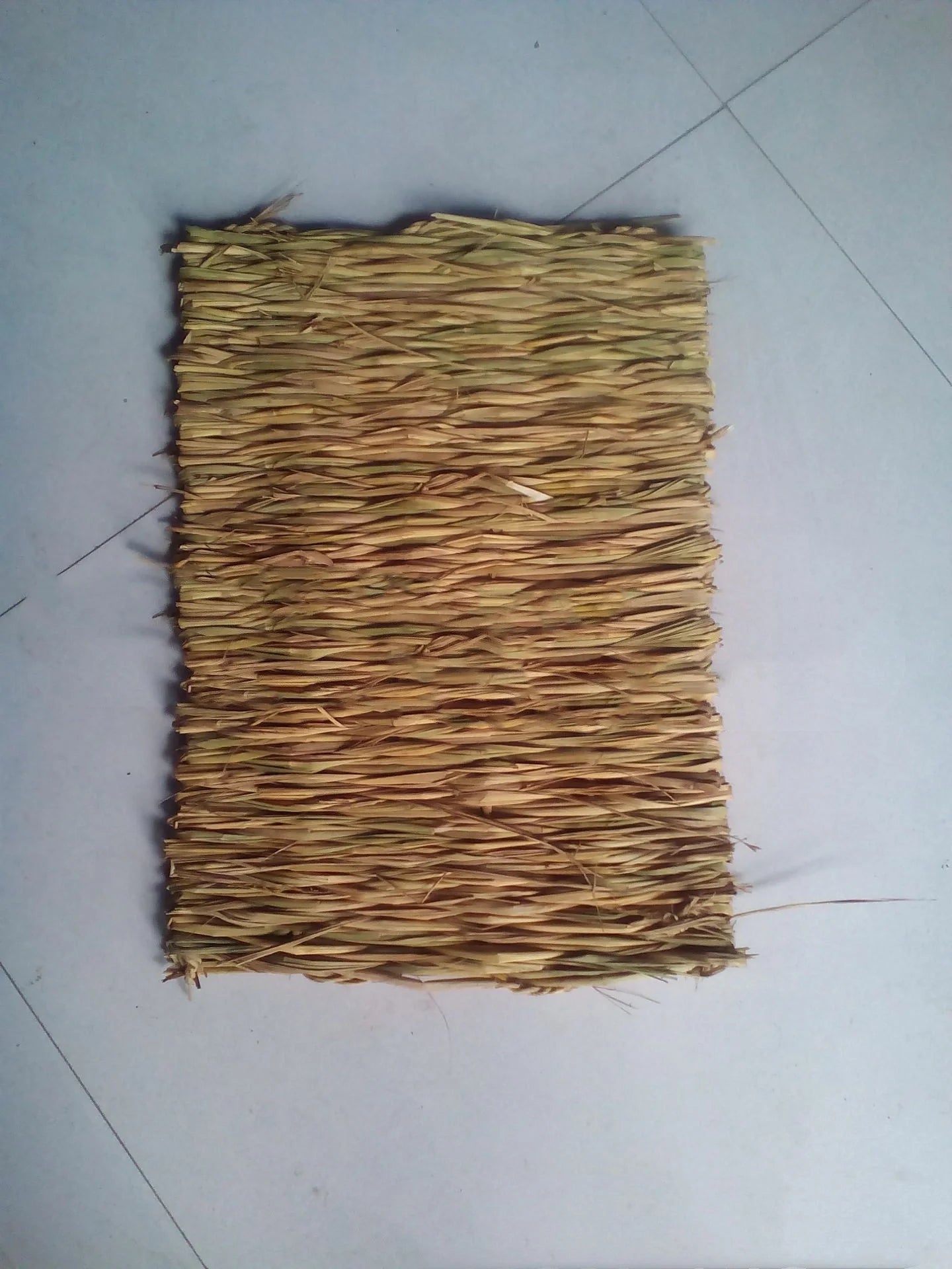 Premium handwoven straw mat for pets, featuring a textured surface and durable construction for comfort and functionality.