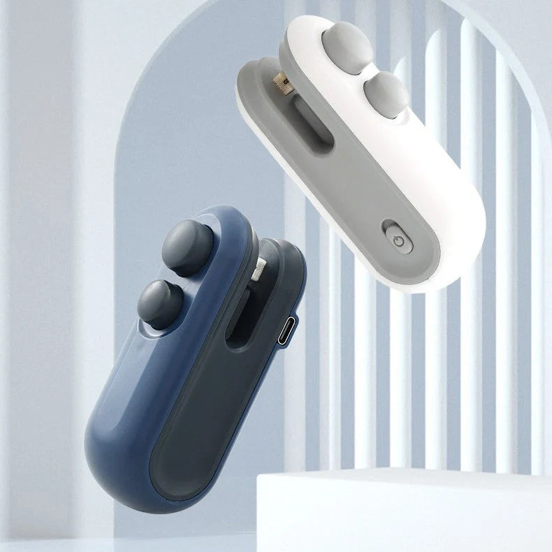 Compact USB rechargeable handheld vacuum sealer in white and blue