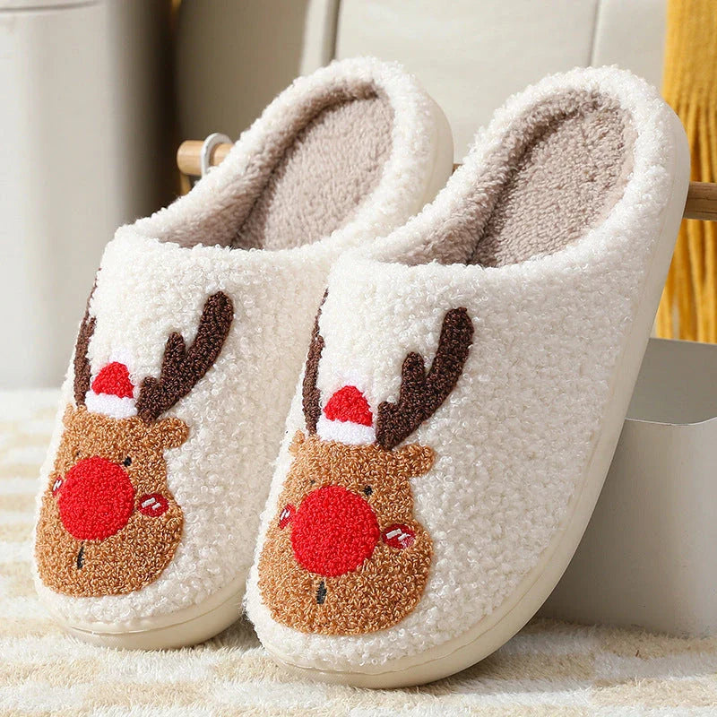 Cozy elk-themed slip-on house slippers in festive red and green colors with plush, soft materials for comfortable holiday relaxation