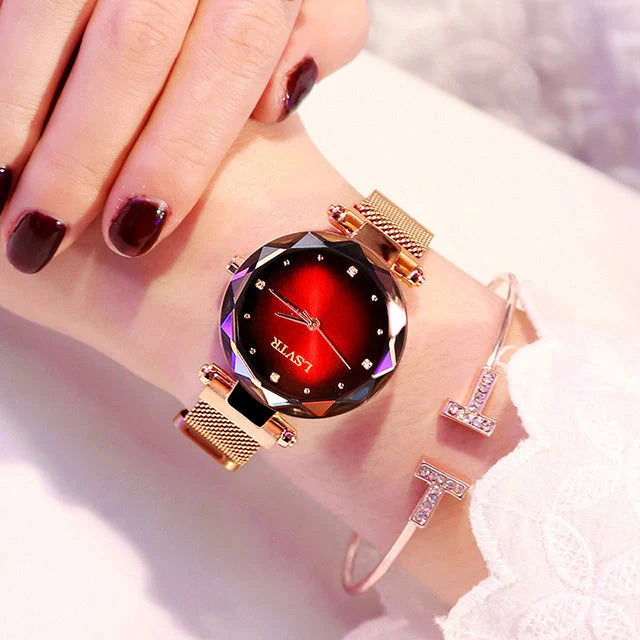 Elegant rose gold ladies' watch with diamond accents on a magnet strap