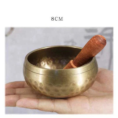 A handcrafted Tibetan singing bowl made of copper, used for meditation and relaxation.