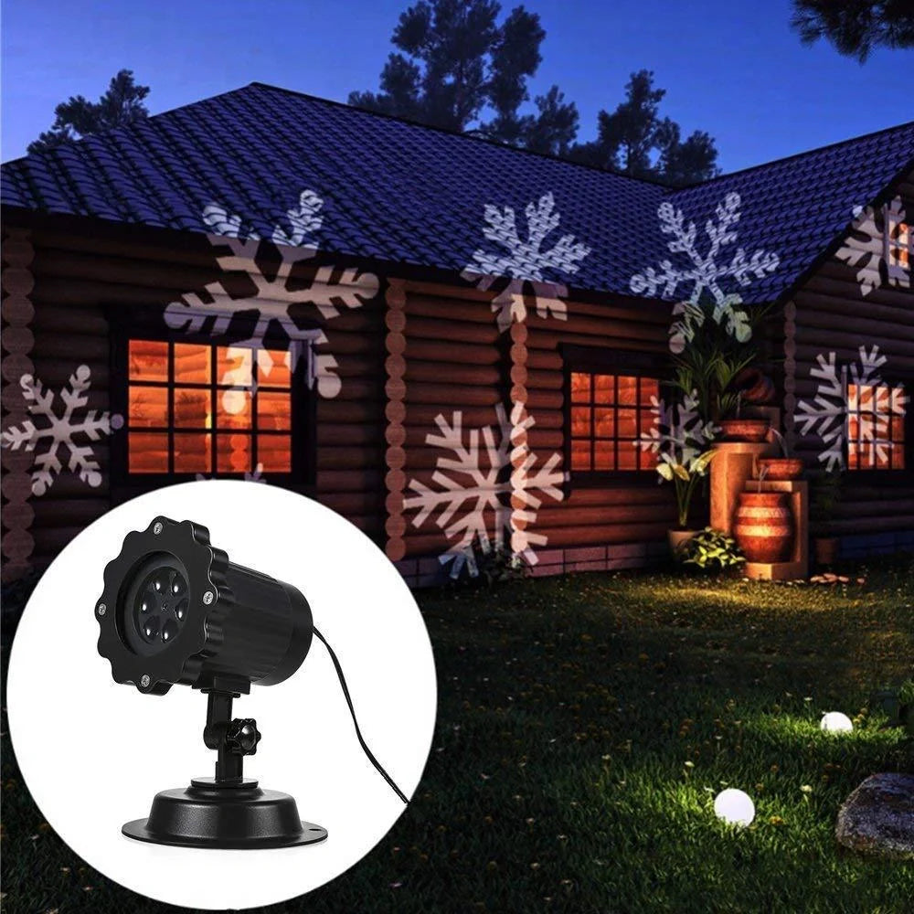 LED Christmas Blizzard Snowflake Laser Light Projector illuminating a garden with white snowflake patterns