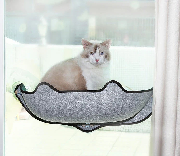 Cozy window-mounted cat hammock with soft, breathable felt cloth and powerful suction cups for easy installation on any flat surface
