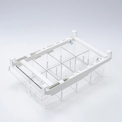 Transparent rectangular storage box with modular grid system for organised storage in kitchen or office