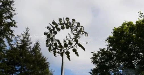 Elegant revolving metal windmill outdoor ornament with dual-layered blades creating a mesmerizing display in the garden