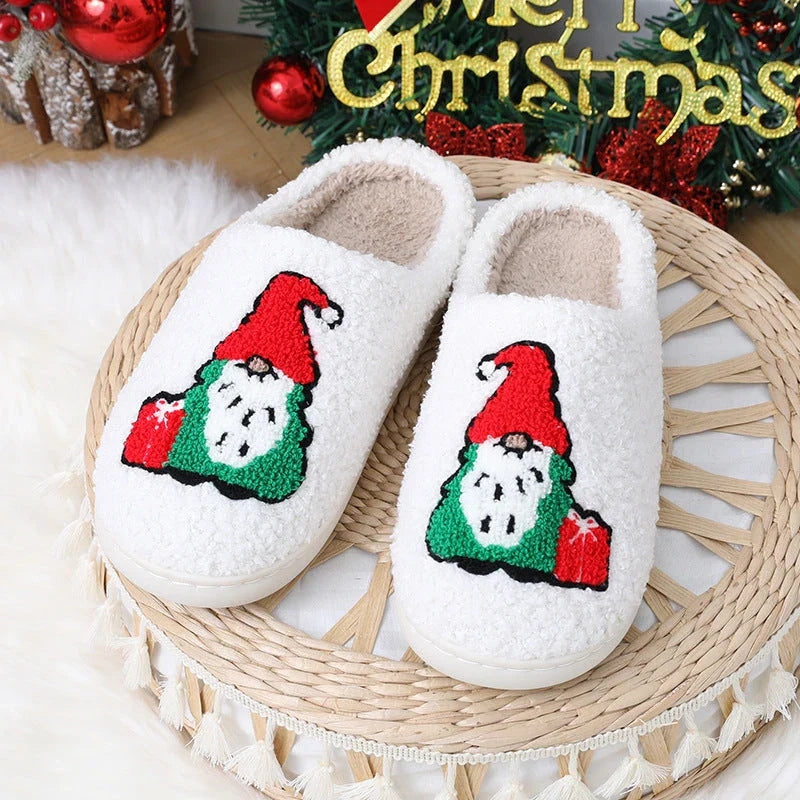 Cozy Christmas-themed slip-on slippers with a charming Santa Claus design, perfect for indoor comfort and warmth during the holiday season.