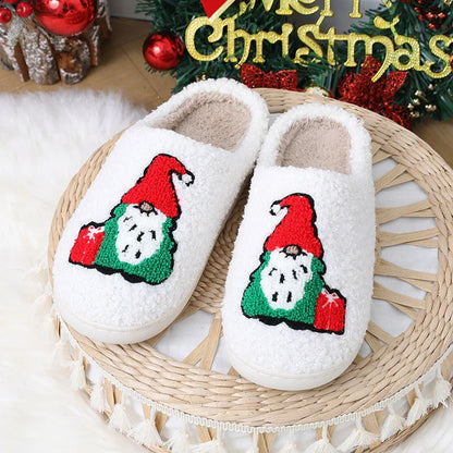 Cozy Christmas-themed slip-on slippers with a charming Santa Claus design, perfect for indoor comfort and warmth during the holiday season.