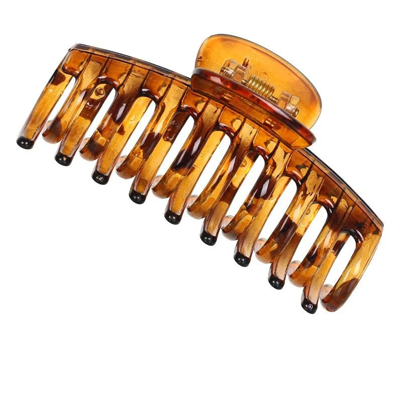 Candy-coloured plastic ponytail clip for showers and daily hair styling