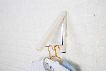 Convenient folding clothes drying rack with sturdy plastic and steel construction, providing generous hanging space for laundry in small living spaces.