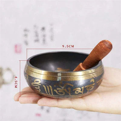 A handcrafted Tibetan singing bowl made of copper, used for meditation and relaxation.