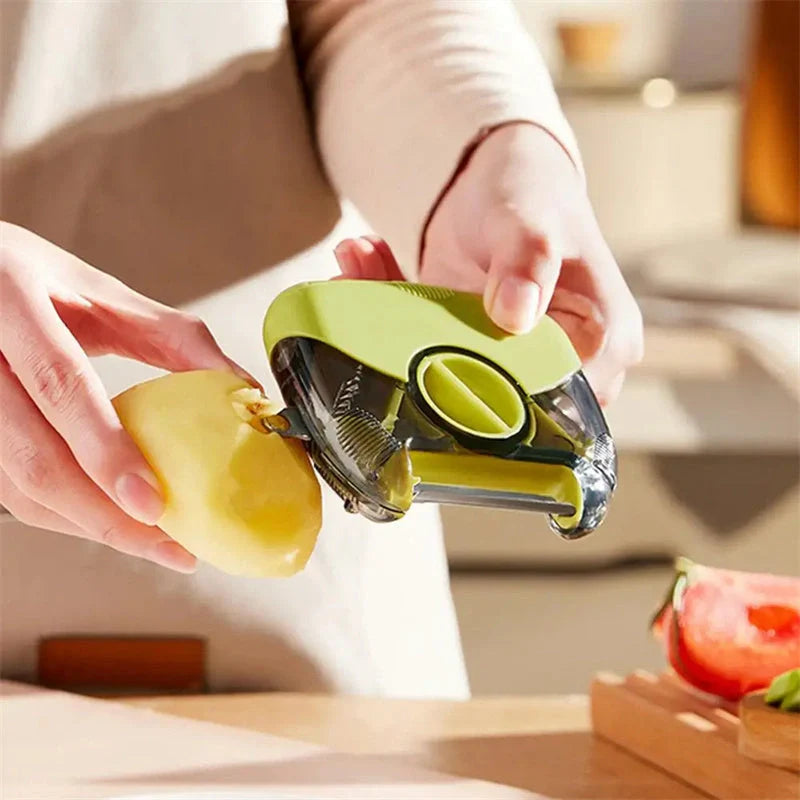 3-in-1 Stainless Steel Peeler Shredder in green and grey with ergonomic handle