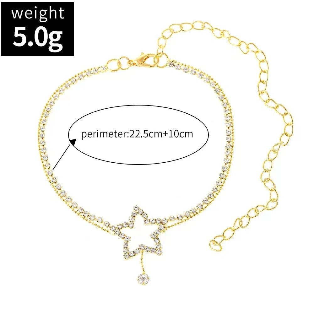 Sparkling star-shaped rhinestone necklace and anklet jewellery set in gold and silver tones