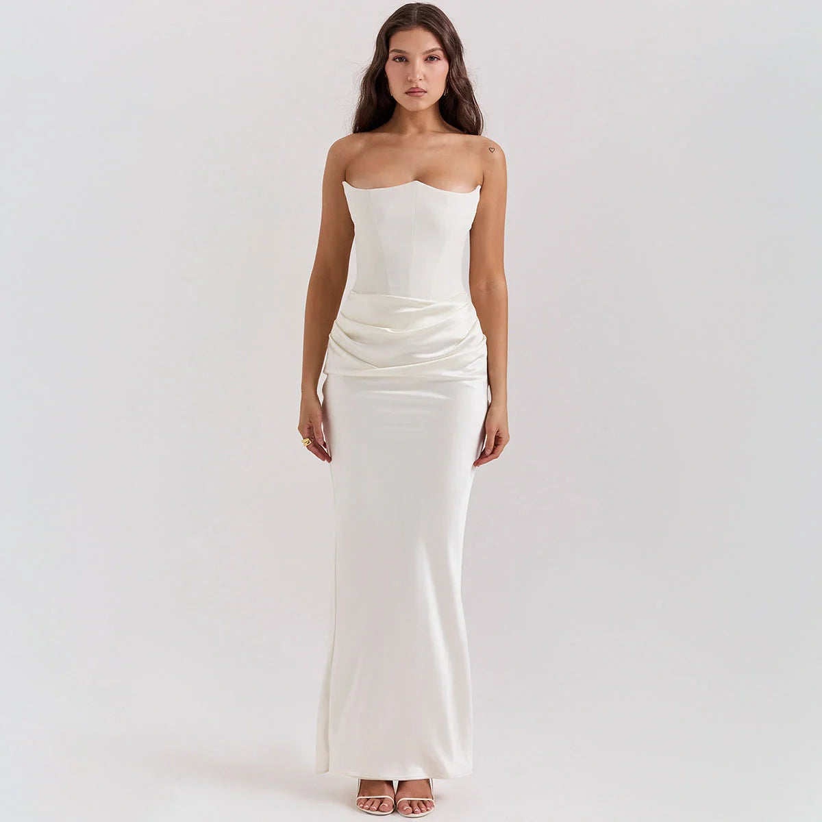 Elegant backless tube top dress in a variety of colours, featuring a sleek and sophisticated design for special occasions