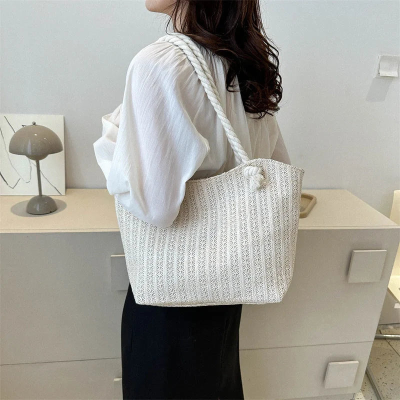 Stylish women's straw shoulder tote bag with large capacity, perfect for summer and everyday use.