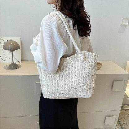 Stylish women's straw shoulder tote bag with large capacity, perfect for summer and everyday use.