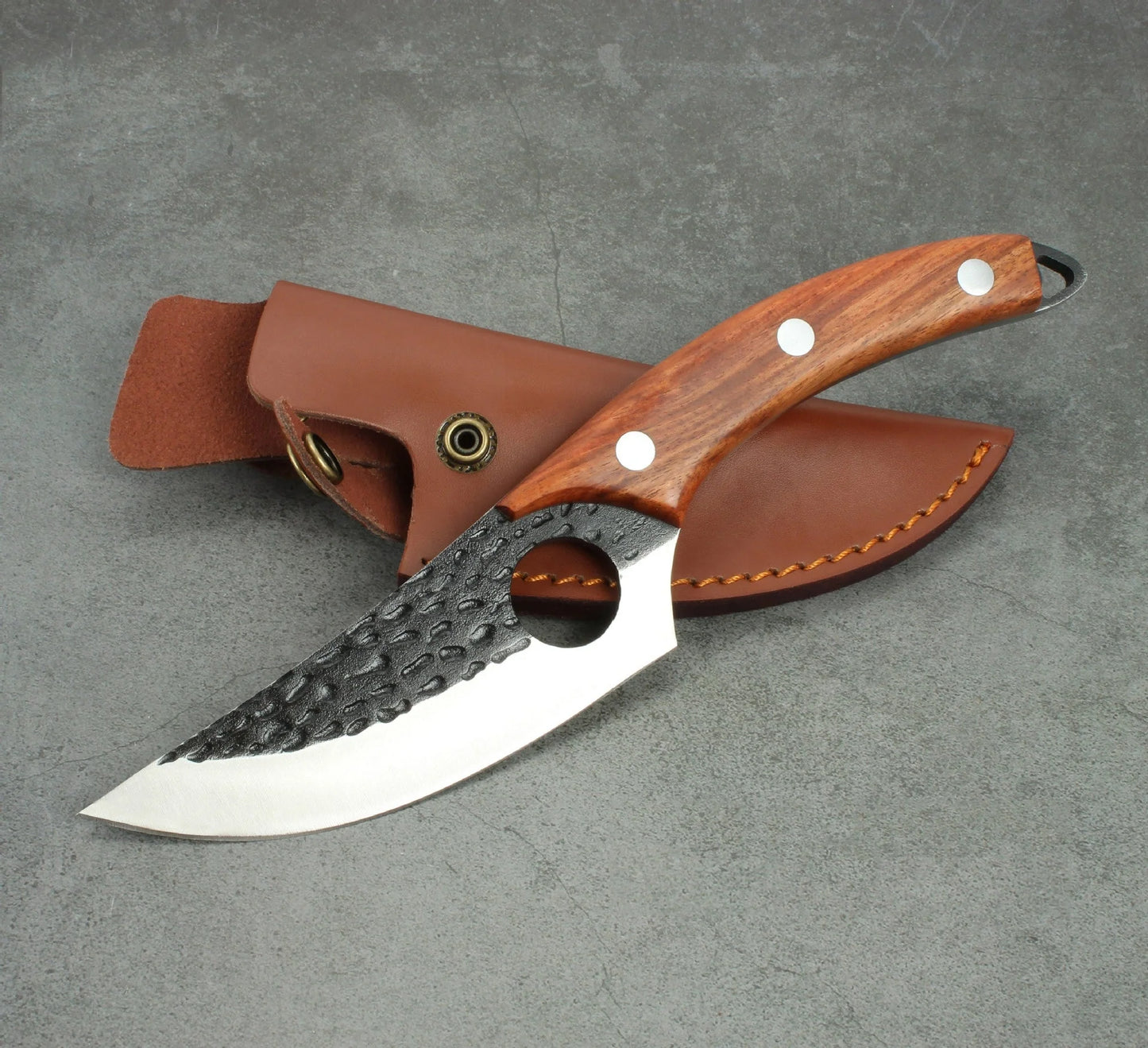Forged stainless steel boning knife with ergonomic handle and leather sheath