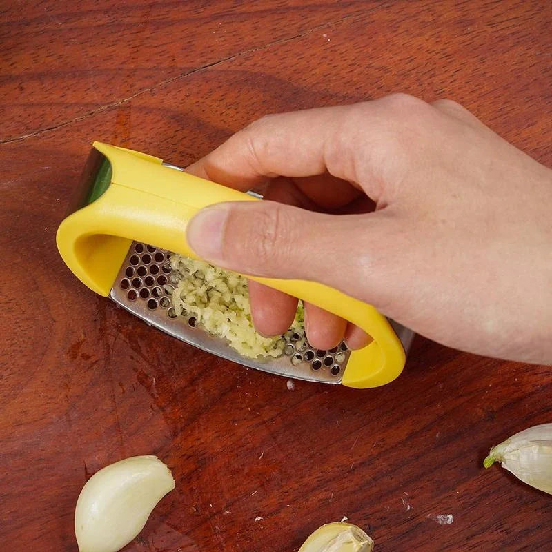 Stainless steel garlic press with ergonomic handle for easy mashing
